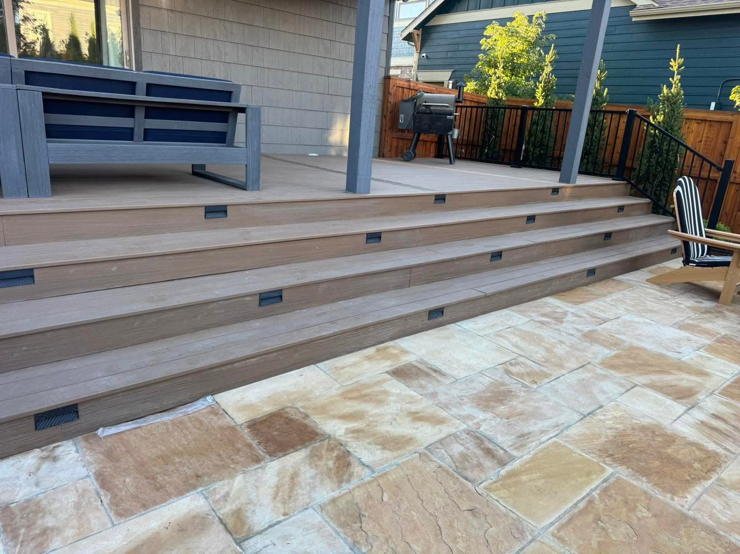 Composite decking with geometric stone paver pattern