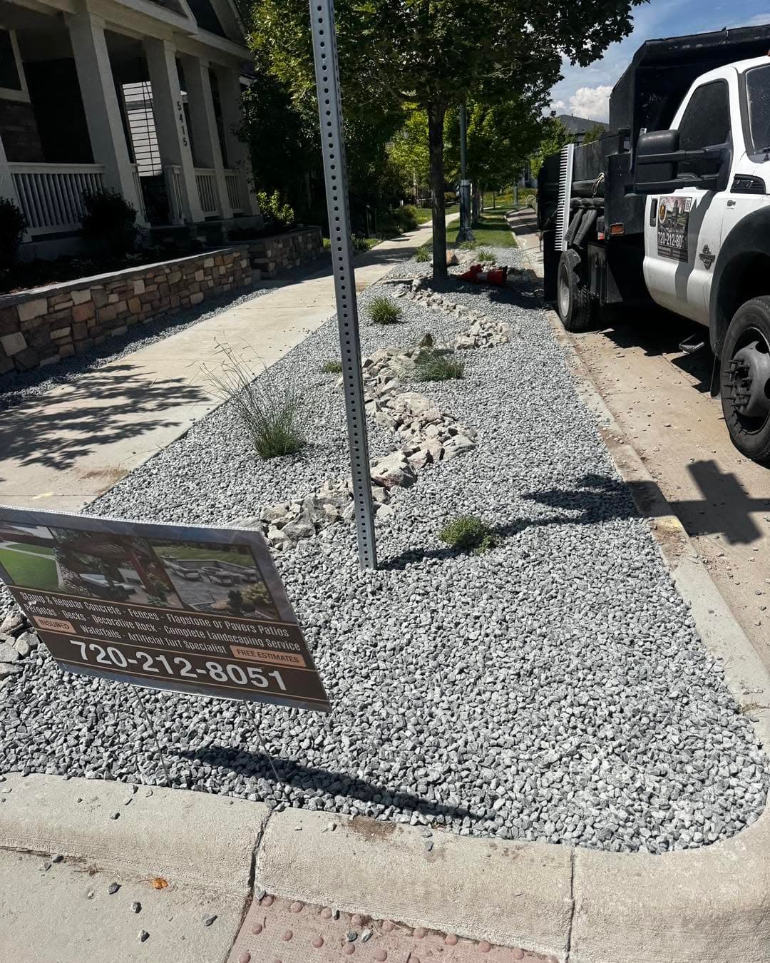 Residential driveway with gravel material and landscaped yard edge
